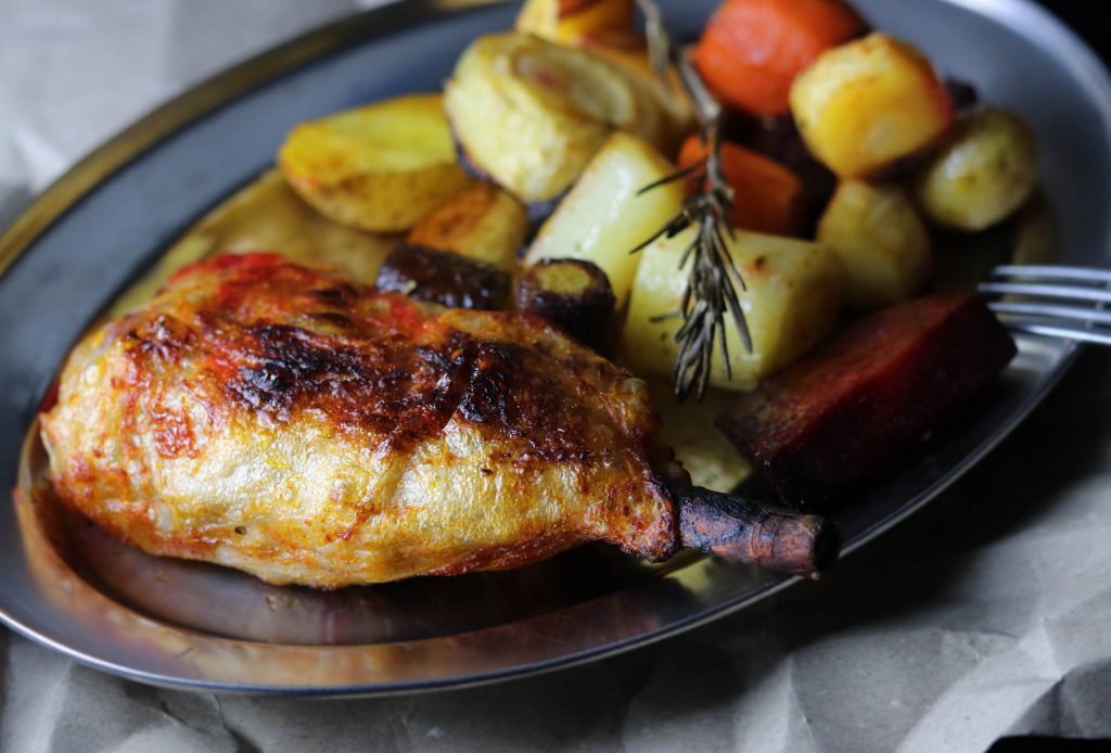 Crispy vegan chicken drumsticks on veggies Dailyvegan