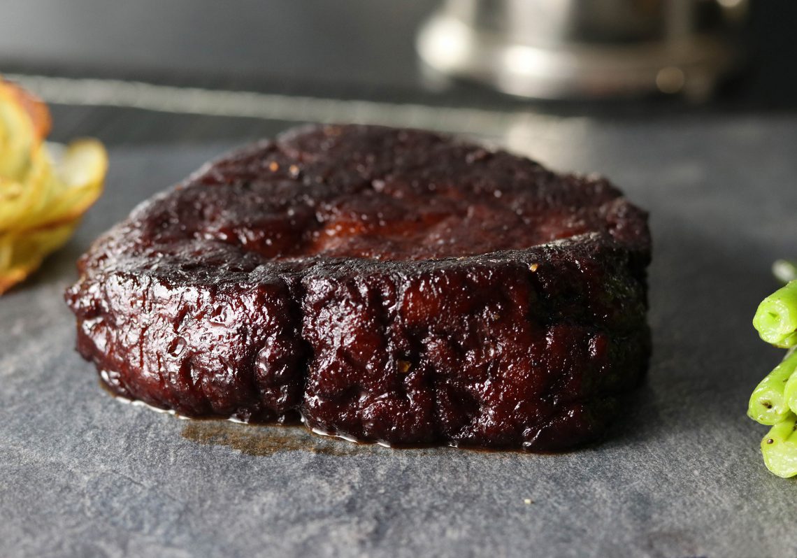 Seitan steaks in red wine glaze with potato roses and green beans